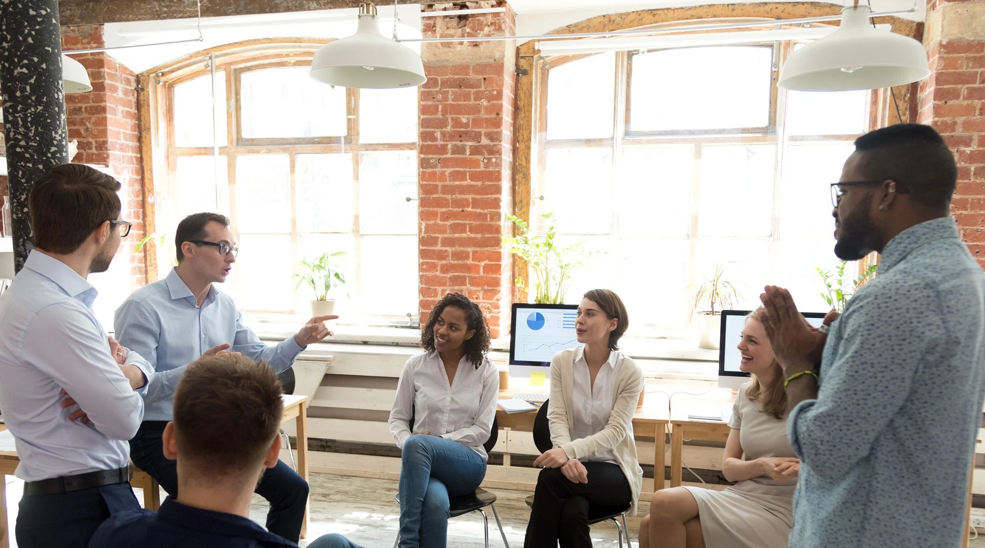 HFMA Career Resources; Image of a man talking to a group of people; HFMA Career Pathways